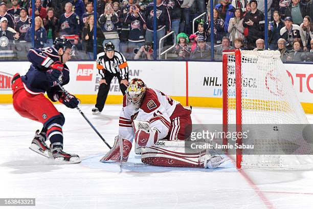 Artem Anisimov of the Columbus Blue Jackets scored a shootout goal on goaltender Mike Smith of the Phoenix Coyotes on March 16, 2013 at Nationwide...