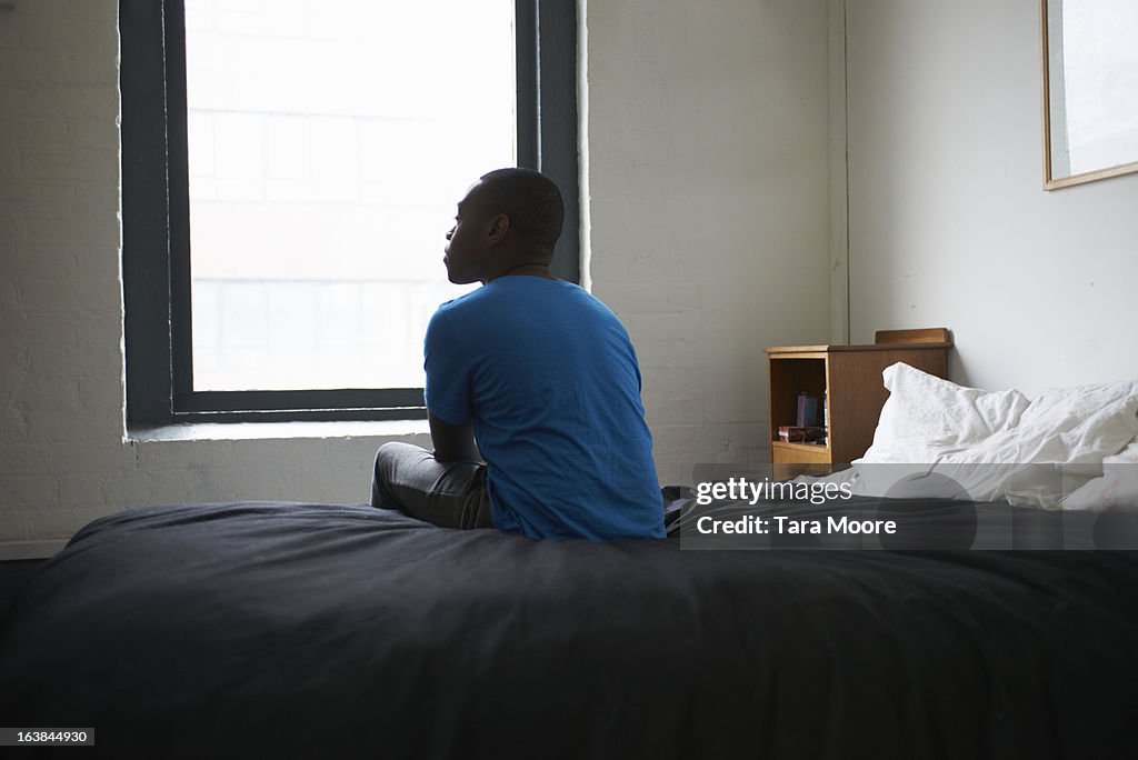 Man sitting on bed