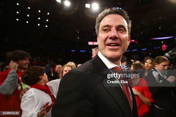 Head coach Rick Pitino of the Louisville Cardinals celebrates after they won 78-61 against the Syracuse Orange during the final of the Big East Men's...