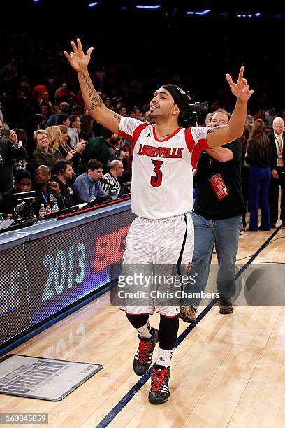 Peyton Siva of the Louisville Cardinals celebrates after they won 78-61 against the Syracuse Orange during the final of the Big East Men's Basketball...