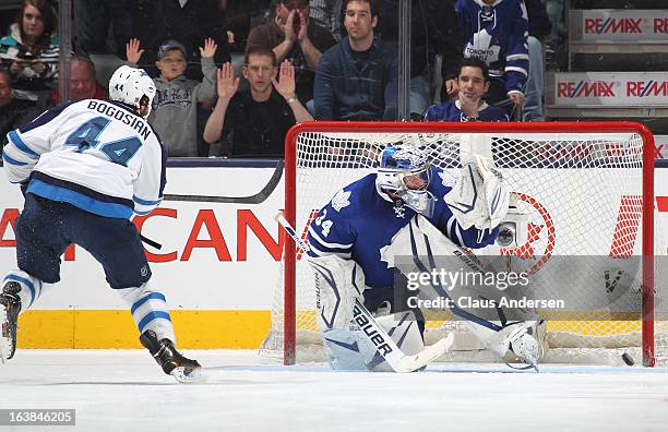 Zach Bogosian of the Winnipeg Jets buries the winning goal in the shootout against James Reimer of the Toronto Maple Leafs on March 16, 2013 at the...