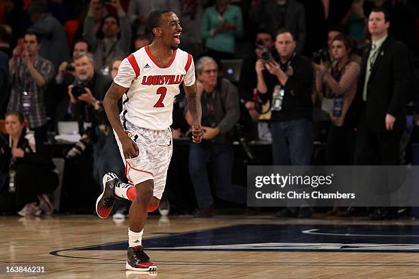 Russ Smith of the Louisville Cardinals celebrates after they won 78-61 against the Syracuse Orange during the final of the Big East Men's Basketball...
