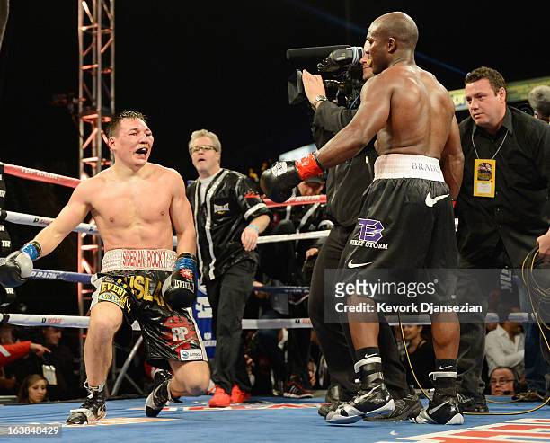 Ruslan Provodnikov goes to his knees at the end of the boxing match against WBO Welterweight Champion Timothy Bradley during the WBO Welterweight...