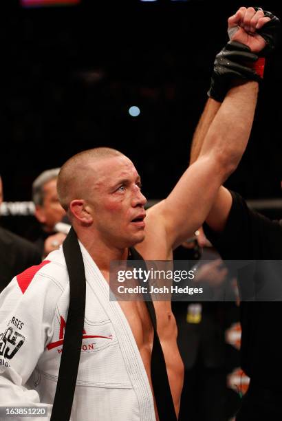 Georges St-Pierre reacts after his victory over Nick Diaz in their welterweight championship bout during the UFC 158 event at Bell Centre on March...