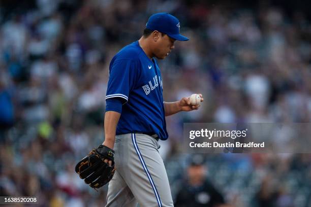Hyun Jin Ryu of the Toronto Blue Jays reacts after allowing a two-run homerun in the third inning against the Colorado Rockies at Coors Field on...