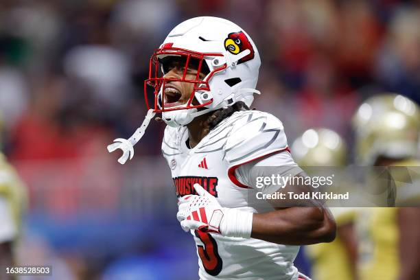 Kevin Coleman of the Louisville Cardinals reacts after scoring a touchdown during the second quarter against the Georgia Tech Yellow Jackets at...