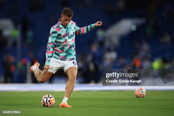 Ross Barkley of Luton Town warms up prior to the Premier League match between Chelsea FC and Luton Town at Stamford Bridge on August 25, 2023 in...