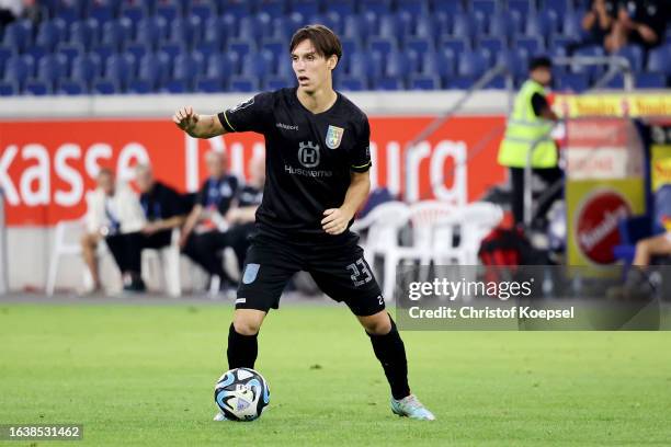 Max Brandt of Ulm runs with the ball during the 3. Liga match between MSV Duisburg and SSV Ulm 1846 at Schauinsland-Reisen-Arena on August 25, 2023...