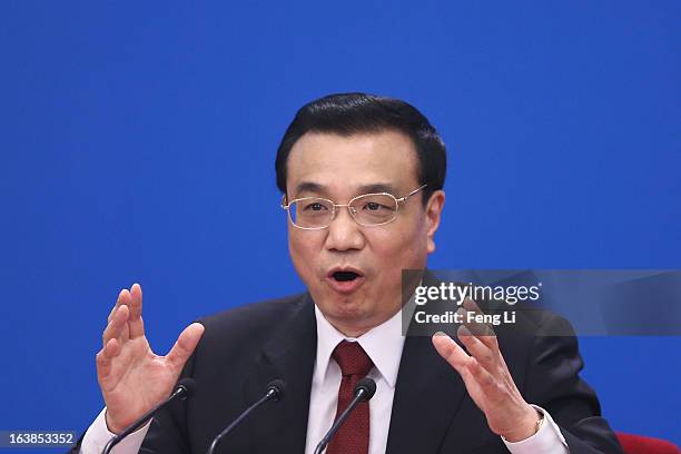 China's newly elected Premier Li Keqiang speaks during a news conference after the closing session of the National People's Congress at the Great...