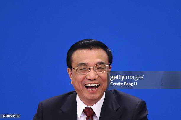 China's newly elected Premier Li Keqiang speaks during a news conference after the closing session of the National People's Congress at the Great...