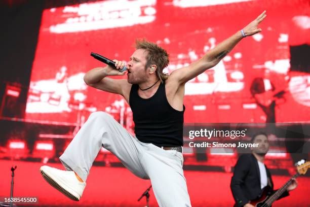 Rou Reynolds of Enter Shikari joins You Me At Six on stage during day one of Reading Festival 2023 at Richfield Avenue on August 25, 2023 in Reading,...