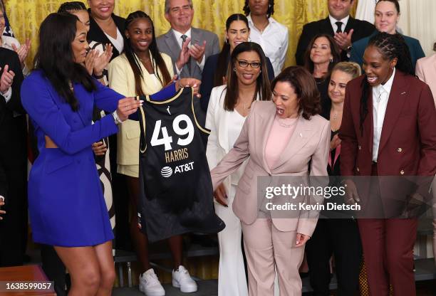 Las Vegas Aces' forward A'ja Wilson and guard Chelsea Gray present Vice President Kamala Harris with a jersey as Harris honors the 2022 WNBA Champion...