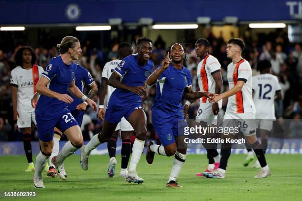 Raheem Sterling of Chelsea celebrates after scoring the team's first goal during the Premier League match between Chelsea FC and Luton Town at...