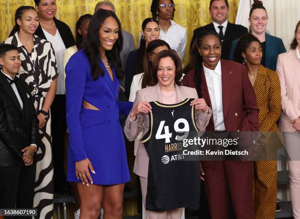 Las Vegas Aces' forward A'ja Wilson and guard Chelsea Gray present Vice President Kamala Harris with a jersey as Harris honors the 2022 WNBA Champion...