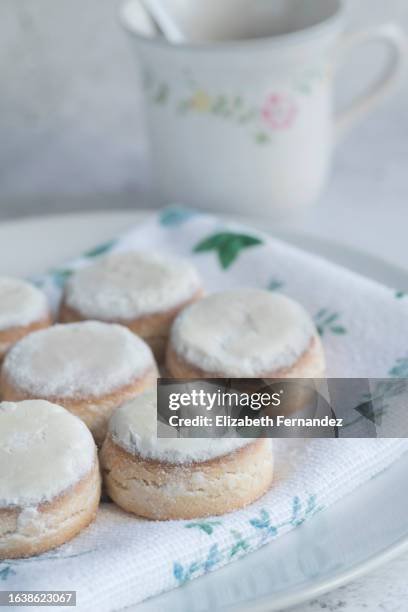 spanish christmas sweets: puff pastries with icing sugar / nevaditos. - yule marble stock pictures, royalty-free photos & images