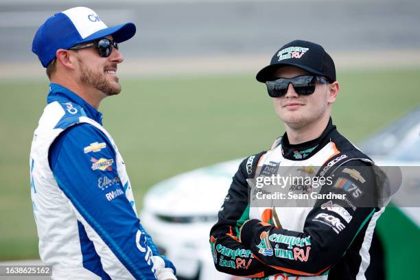 Daniel Hemric, driver of the Cirkul Chevrolet, and Justin Haley, driver of the Campers Inn RV Chevrolet, talk on the grid during qualifying for the...