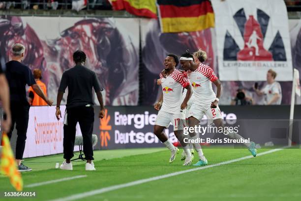 Lois Openda of RB Leipzig celebrates with teammate Mohamed Simakan after scoring the team's second goal which is later disallowed during the...