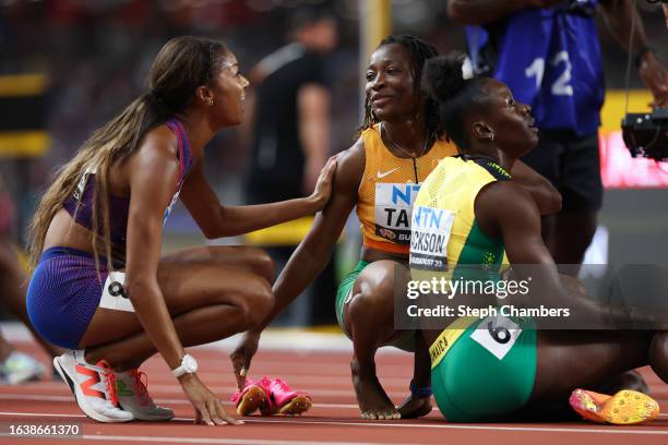 Gabrielle Thomas of Team United States, Marie-Josee Ta Lou of Team Ivory Coast and Shericka Jackson of Team Jamaica react after the Women's 200m...