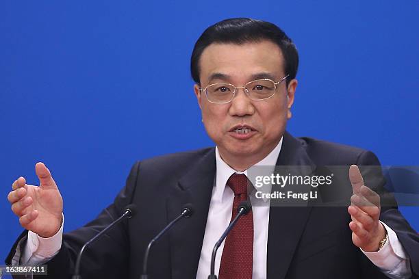 China's newly elected Premier Li Keqiang speaks during a news conference after the closing session of the National People's Congress at the Great...