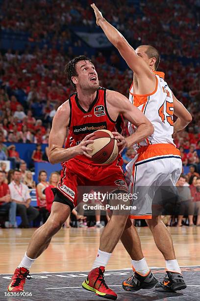 Jeremiah Trueman of the Wildcats looks to shoot against Dusty Rychart of the Taipans during the round 23 NBL match between the Perth Wildcats and the...