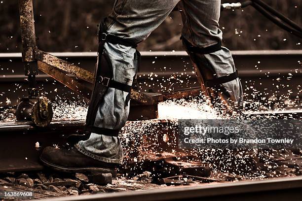 final touches - knieschützer stock-fotos und bilder