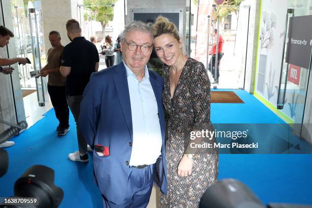 Dominique Besnehard and Julie Gayet attend the 'L'Homme de Pekin' Photocall during Day Four of the 16th Angouleme French-Speaking Film Festival on...