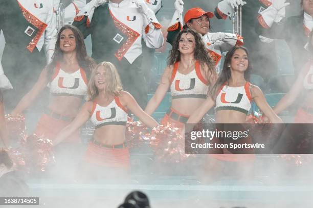 Miami Hurricanes cheerleaders dance in the smoke during the game between the Miami Redhawks and the Miami Hurricanes on Friday, September 1, 2023 at...