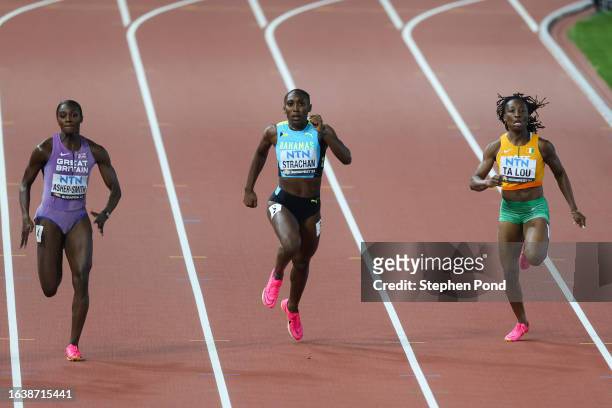 Anthonique Strachan of Team Bahamas and Marie-Josee Ta Lou of Team Ivory Coast compete in the Women's 200m Final during day seven of the World...