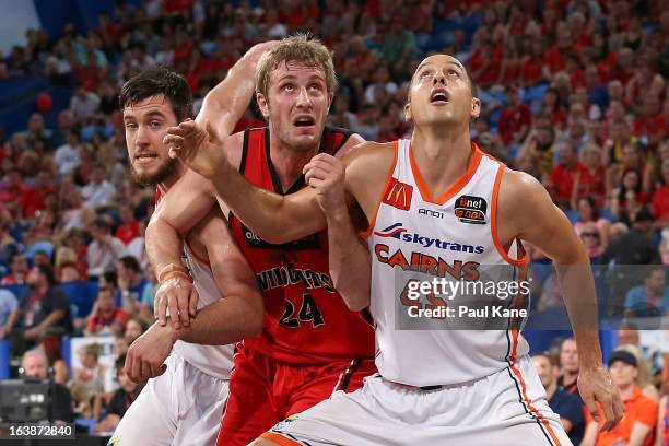 Jesse Wagstaff of the Wildcats contests position at free throw against Brad Hill and Dusty Rychart of the Taipans during the round 23 NBL match...