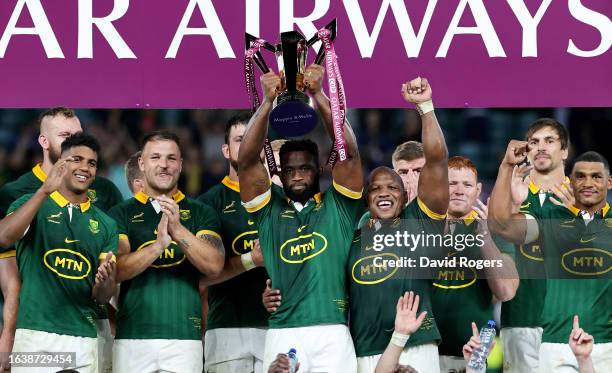 Siya Kolisi of South Africa lifts the Qatar Airways Cup trophy after the team's victory following the Summer International match between New Zealand...