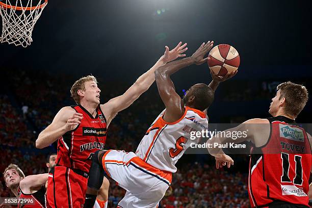 Shawn Redhage of the Wildcats blocks Jamar Wilson of the Taipans during the round 23 NBL match between the Perth Wildcats and the Cairns Taipans at...