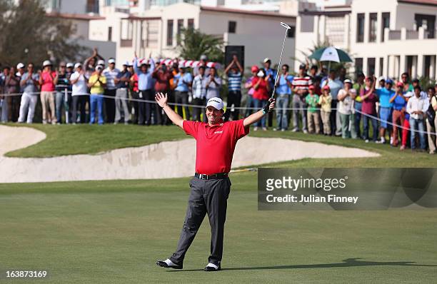 Thomas Aiken of South Africa celebrates victory on the 18th green after a birdie putt during day four of the Avantha Masters at Jaypee Greens Golf...