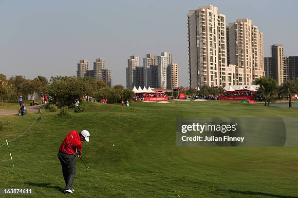 Thomas Aiken of South Africa plays his second shot to the 18th green during day four of the Avantha Masters at Jaypee Greens Golf Club on March 17,...