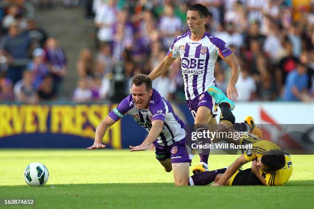 Shane Smeltz of the Glory is brought down by Ian Hogg of the Wellington Phoenix during the round 25 A-League match between the Perth Glory and the...