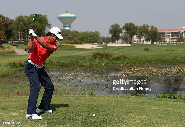 Liang Wenchong of China tees off on hole 13 during day four of the Avantha Masters at Jaypee Greens Golf Club on March 17, 2013 in Delhi, India.