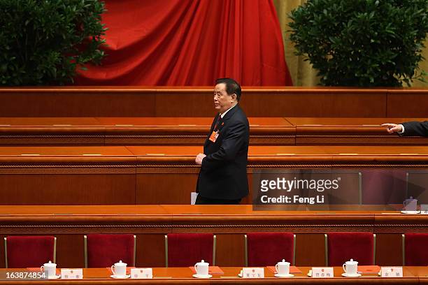 Sheng Guangzu, general manager and party secretary of the China Railway Corporation, arrives the closing session of the National People's Congress at...