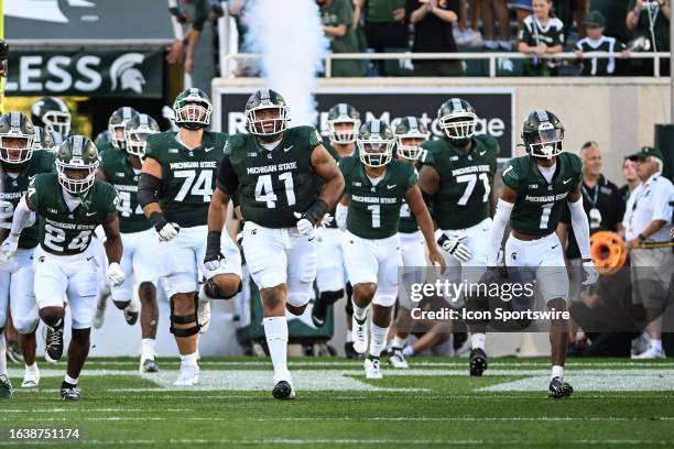 The Michigan State Spartans take the field for a college football game between the Michigan State Spartans and Central Michigan Chippewas on...