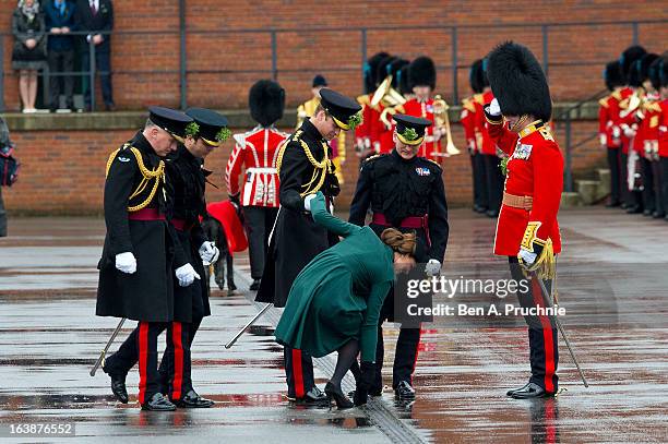 Catherine, Duchess of Cambridge is helped by Prince William, Duke of Cambridge as she gets her heel stuck in the grating while they take part in a St...