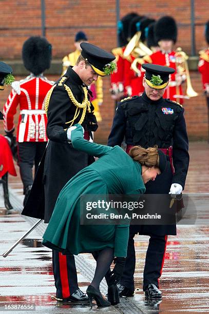 Catherine, Duchess of Cambridge is helped by Prince William, Duke of Cambridge as she gets her heel stuck in the grating while they take part in a St...