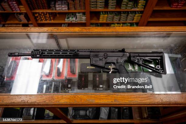 In this photo illustration, a semi-automatic AR-15 is displayed on a countertop at the McBride Guns Inc. Store on August 25, 2023 in Austin, Texas....