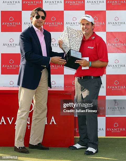 Thomas Aiken of South Africa receives the winners trophy from Gautam Thapar, CEO and Chairman of Avantha Group during day four of the Avantha Masters...