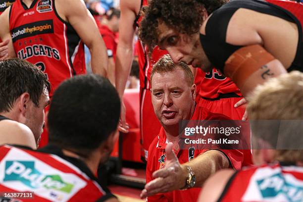 Wildcats coach Rob Beveridge addresses addresses his players at a time-out during the round 23 NBL match between the Perth Wildcats and the Cairns...