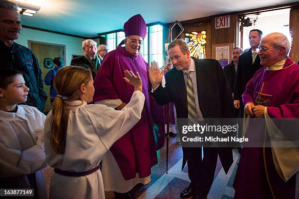 Irish Prime Minister Enda Kenny flanked by Rev. Nicholas DiMarzio , Bishop of Brooklyn, and Monsignor Michael J. Curran , pastor of St. Thomas More...