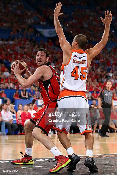 Jeremiah Trueman of the Wildcats looks to shoot against Dusty Rychart of the Taipans during the round 23 NBL match between the Perth Wildcats and the...