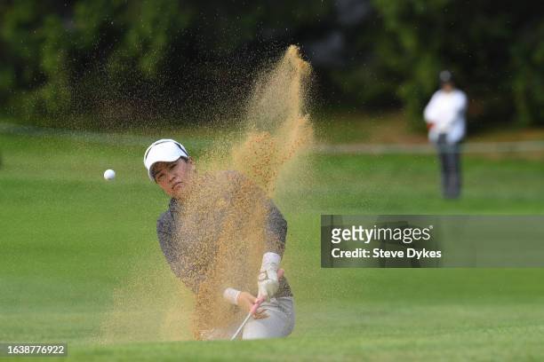 Jasmine Suwannapura of Thailand plays a shot from a bunker on the first hole during the second round of the CPKC Women's Open at Shaughnessy Golf and...