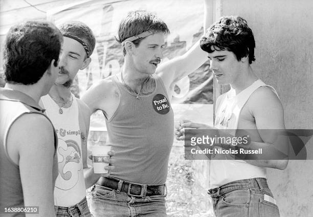 Four young men stand outside of Mary, a popular hangout for gay men in Montrose, in Houston, Texas, August 1981.
