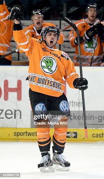 Matt Dzieduszycki of Wolfsburg celebrates after scoring his team's third goal during game three of the DEL pre-play-offs between Thomas Sabo Ice...