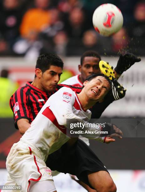 Shinji Okazaki of Stuttgart is challenged by Carlos Zambrano of Frankfurt during the Bundesliga match between Eintracht Frankfurt and VfB Stuttgart...