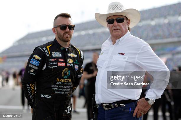Austin Dillon, driver of the BREZTRI Chevrolet, speaks with his grandfather, RCR team owner and NASCAR Hall of Famer, Richard Childress during...