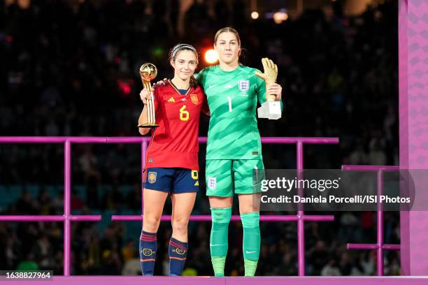 Aitana Bonmatí of Spain gets awarded the adidas Golden Ball Award and Mary Earps of England the adidas Golden Glove Award during the ceremony after...